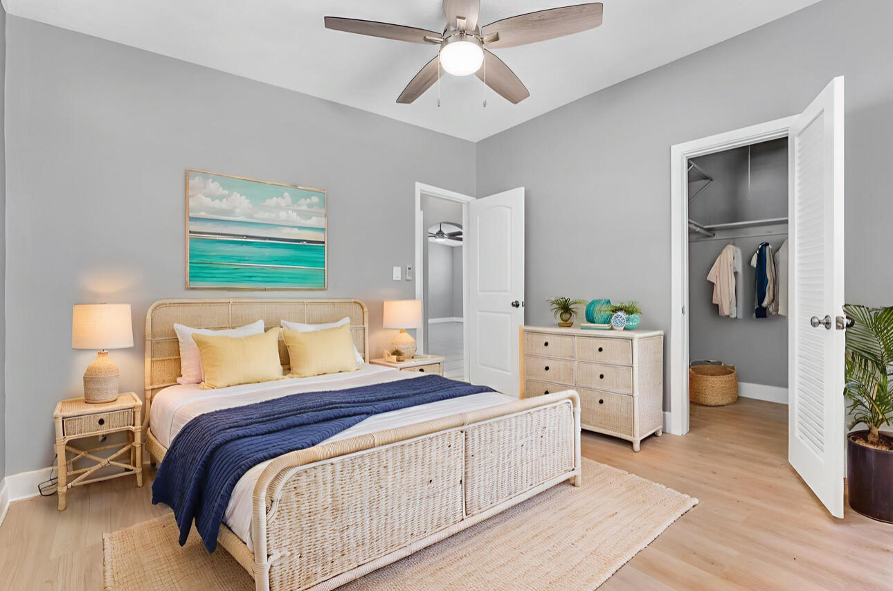 67 Coral Drive, Unit 1 Key Largo, FL 33037 - Photo 18 of 23 a bedroom with a bed and a dresser