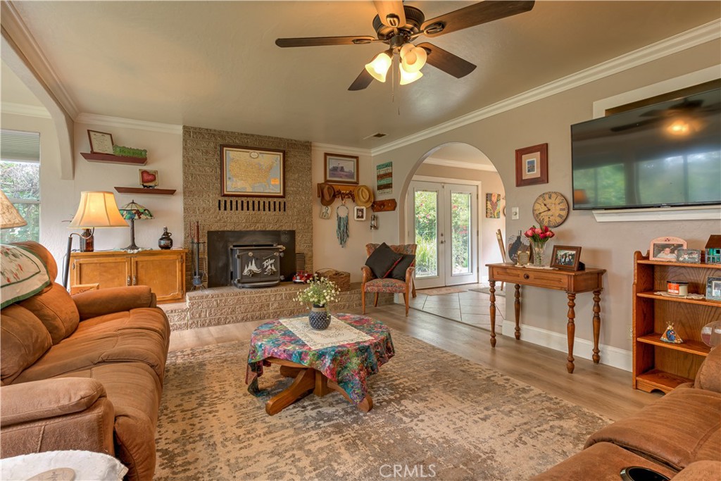 1044 Mt Ida Road Oroville, CA 95966 - Photo 16 of 44 a living room with furniture a flat screen tv and a fireplace