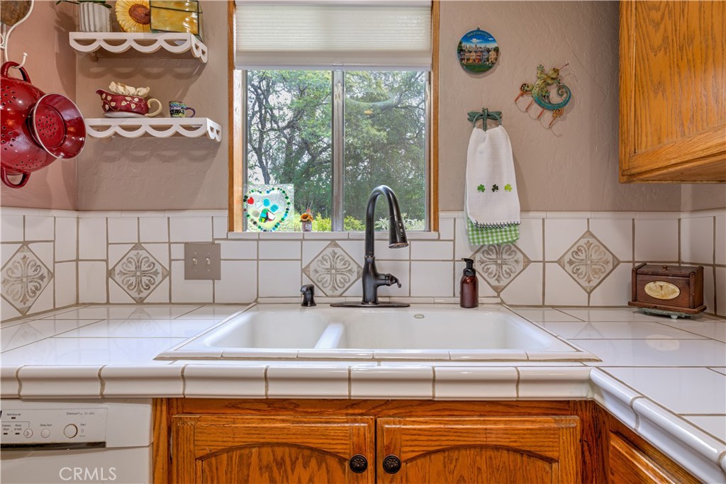 1044 Mt Ida Road Oroville, CA 95966 - Photo 22 of 44 a kitchen with a stove and a sink