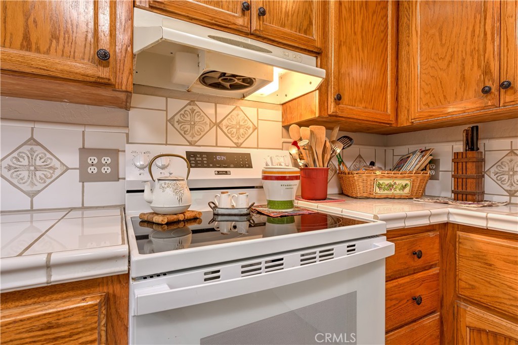 1044 Mt Ida Road Oroville, CA 95966 - Photo 23 of 44 a kitchen with a stove and cabinets