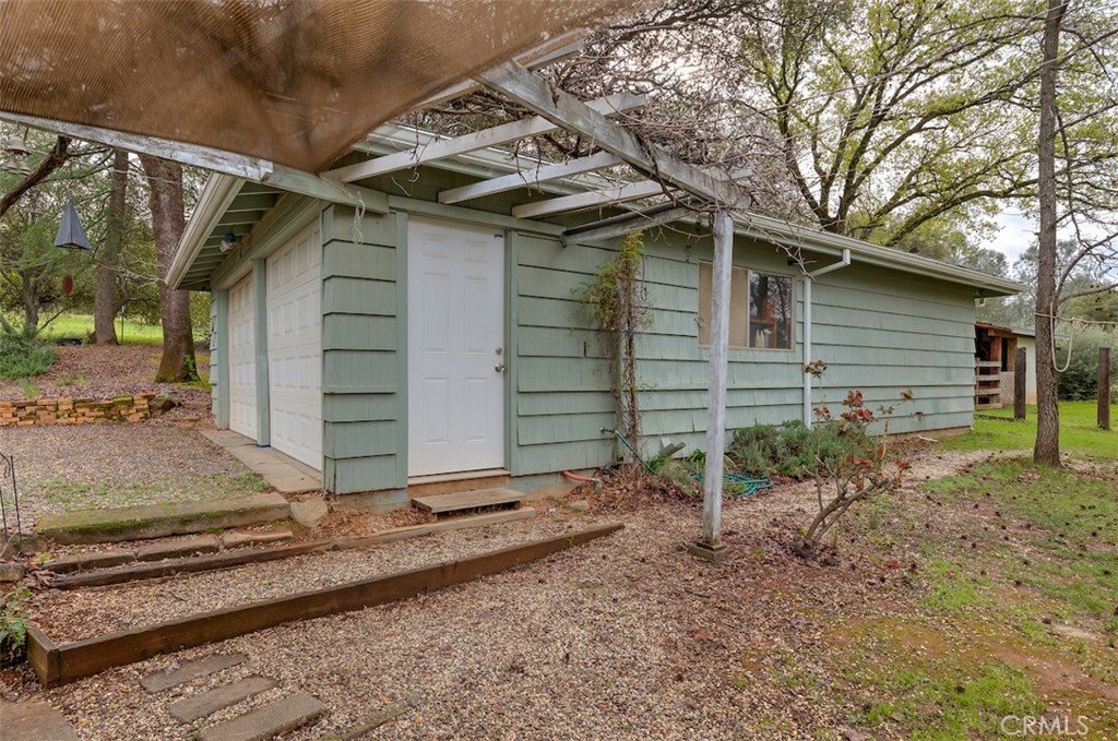 1044 Mt Ida Road Oroville, CA 95966 - Photo 6 of 44 a view of a house with backyard and wooden fence