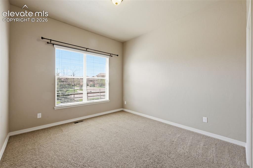 13184 Cake Bread Heights Colorado Springs, CO 80921 - Photo 26 of 47 Main level bedroom with large window