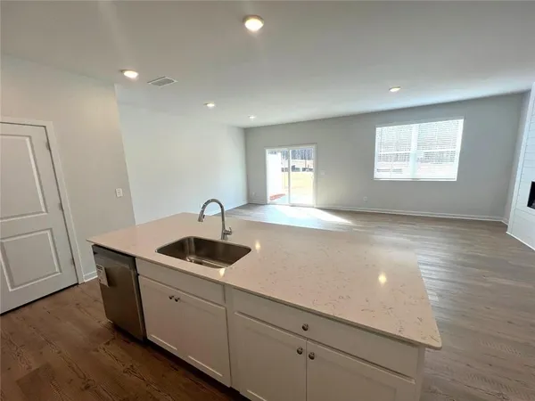 a kitchen with a sink and cabinets