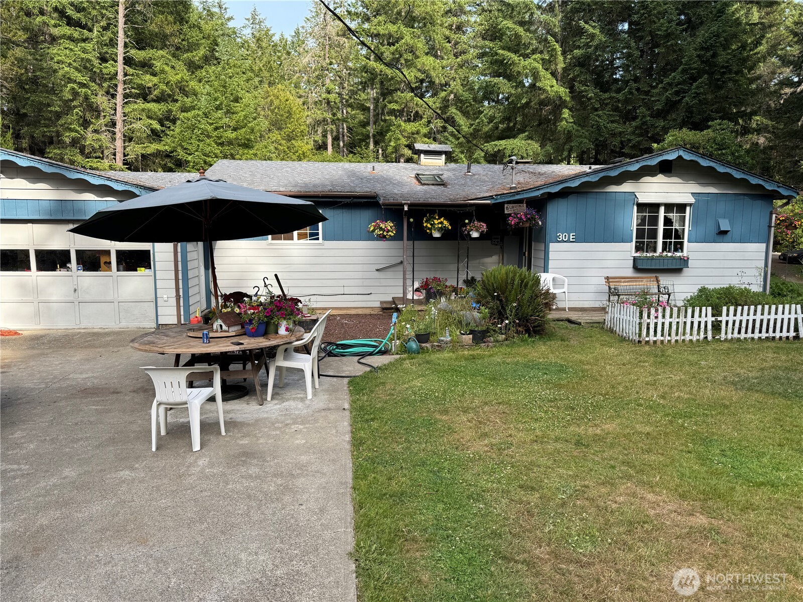 30 Restful Road Grapeview, WA 98546 - Photo 1 of 18 a view of a house with backyard and sitting area