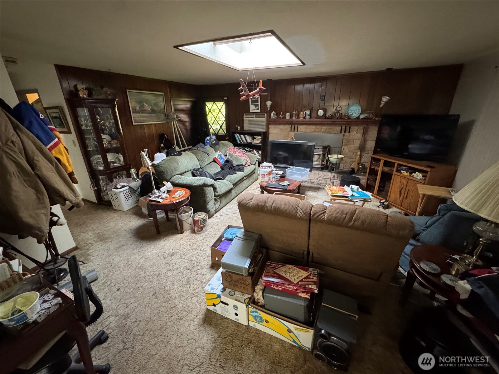 30 Restful Road Grapeview, WA 98546 - Photo 13 of 18 a living room with furniture a flat screen tv and gym equipment