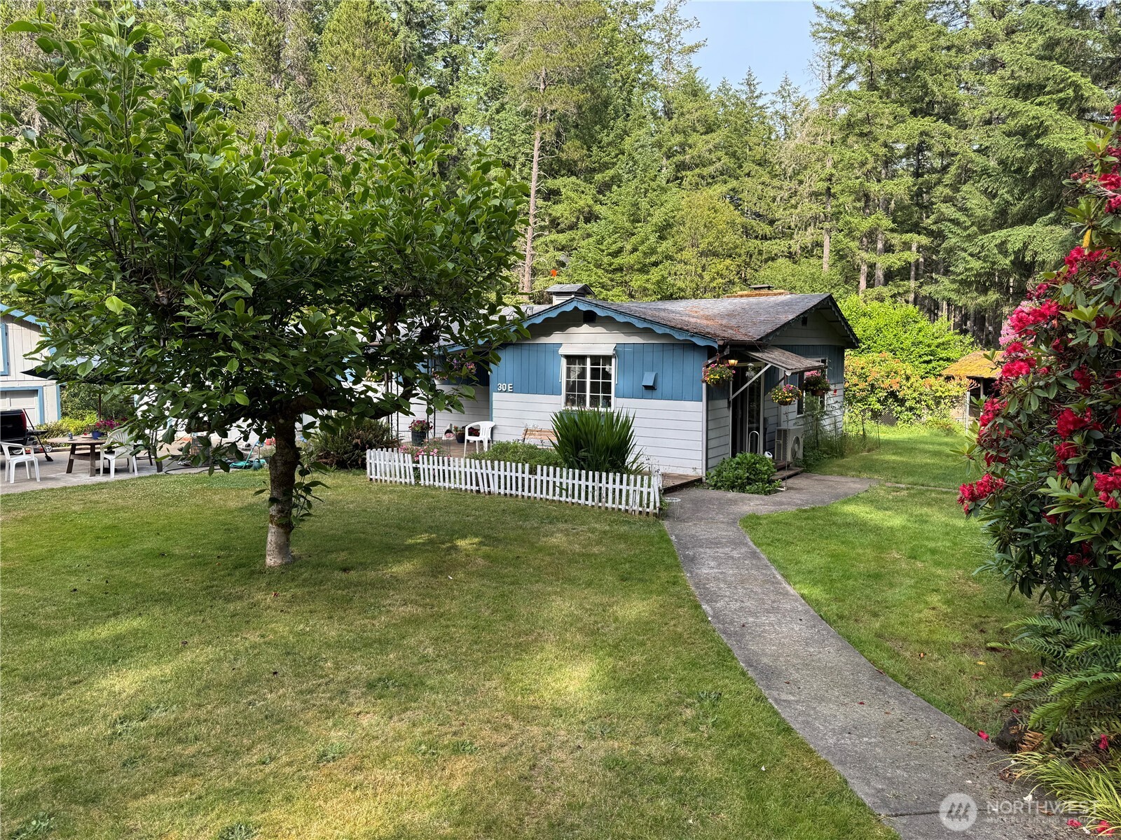 30 Restful Road Grapeview, WA 98546 - Photo 2 of 18 a front view of a house with a yard
