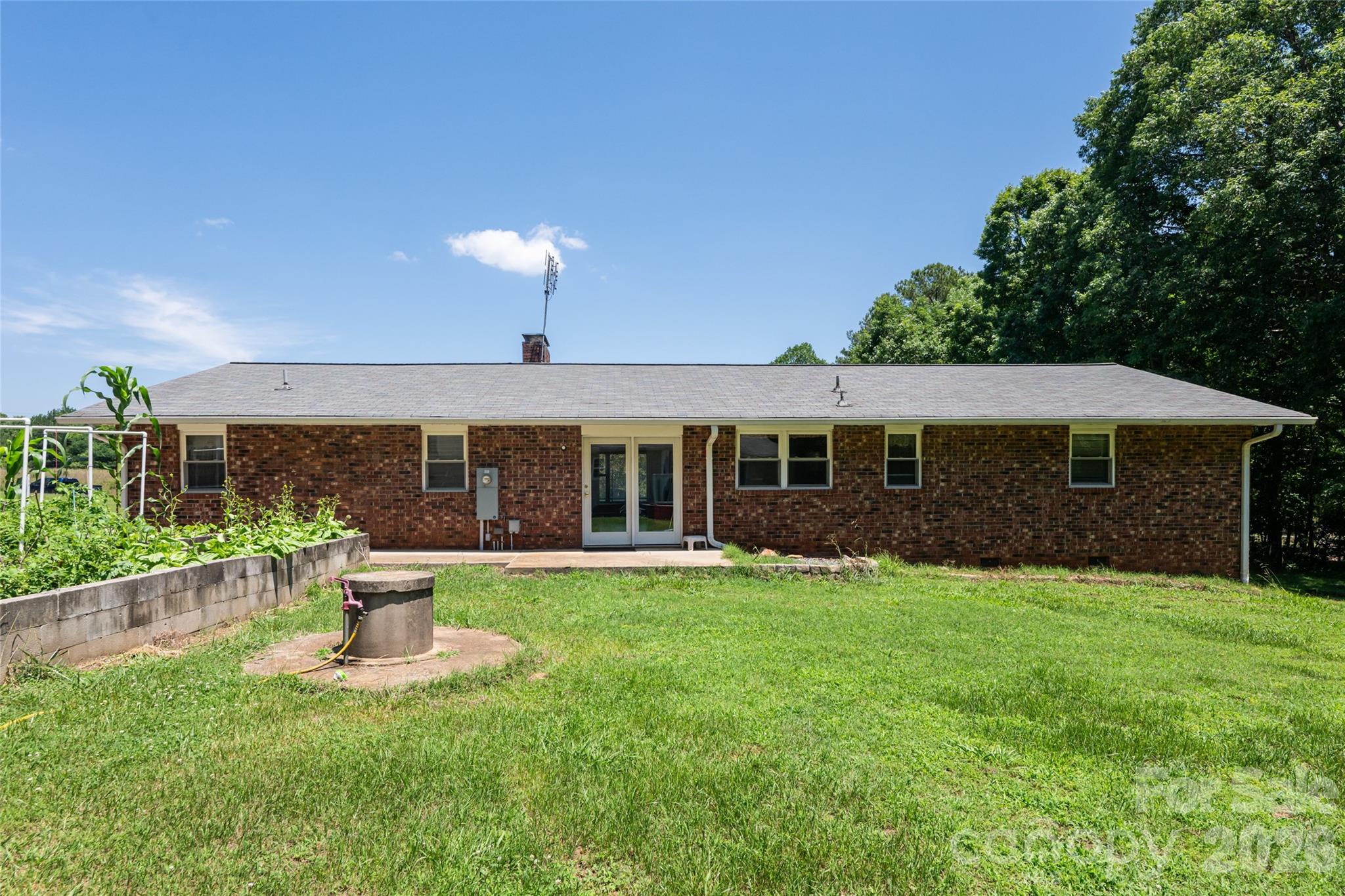 2800 Coxe Road Tryon, NC 28782 - Photo 21 of 40 a front view of a house with a yard
