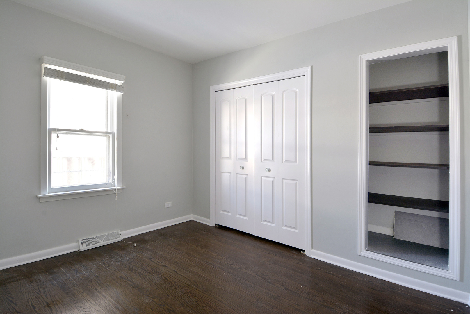 1322 West Central Road Mount Prospect, IL 60056 - Photo 11 of 28 an empty room with wooden floor closet and windows