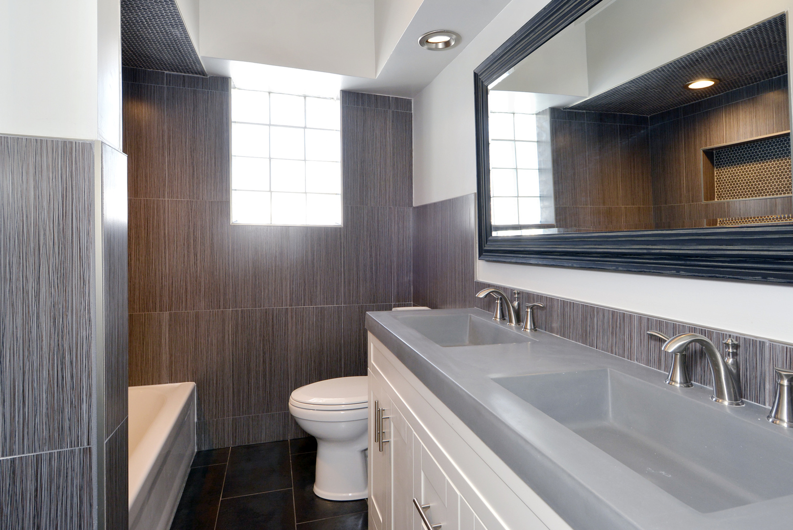 1322 West Central Road Mount Prospect, IL 60056 - Photo 14 of 28 a bathroom with a sink a toilet and mirror