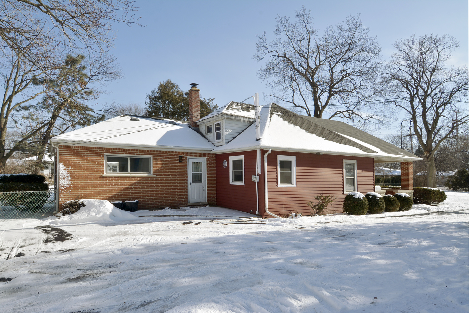 1322 West Central Road Mount Prospect, IL 60056 - Photo 2 of 28 a front view of a house with a yard