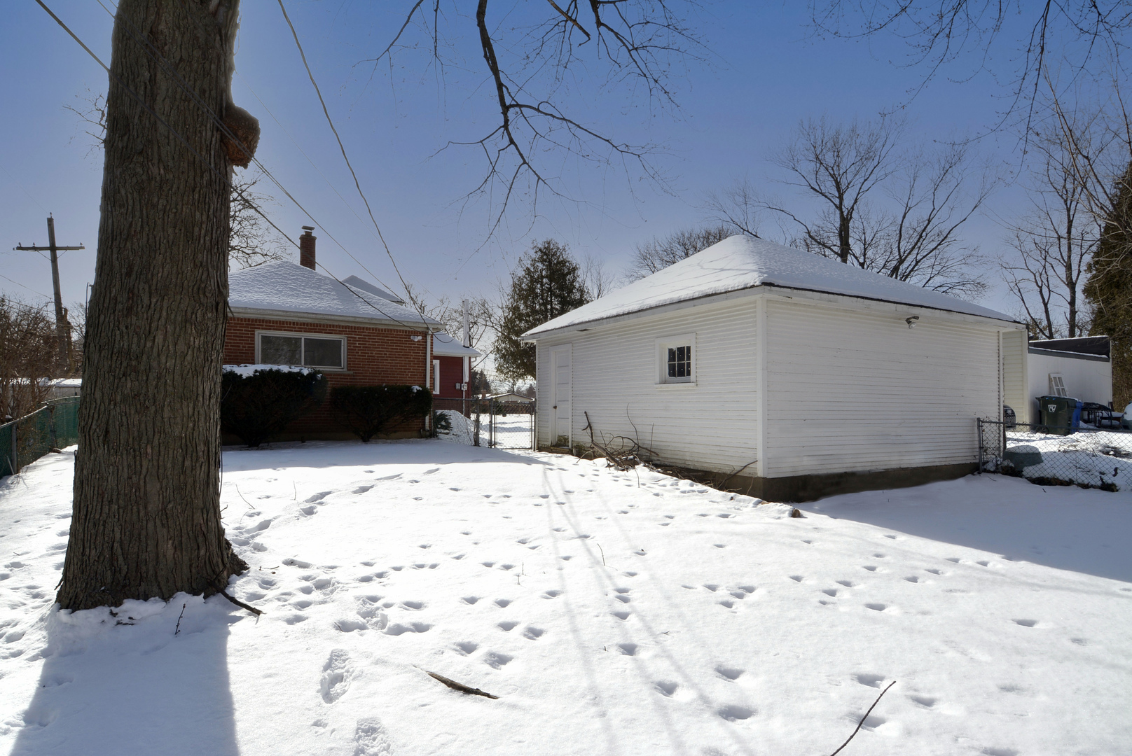 1322 West Central Road Mount Prospect, IL 60056 - Photo 21 of 28 a view of a house with a snow on the road