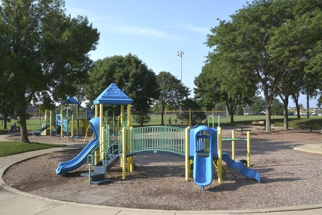 1322 West Central Road Mount Prospect, IL 60056 - Photo 26 of 28 a childrens park with lots of swings slides and swimming pool