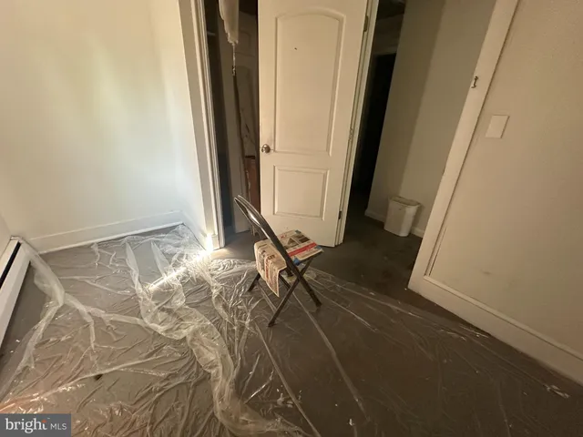 a kitchen with stainless steel appliances a sink a stove a refrigerator a counter space and cabinets