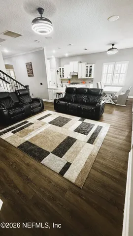 a large kitchen with stainless steel appliances granite countertop a sink and cabinets