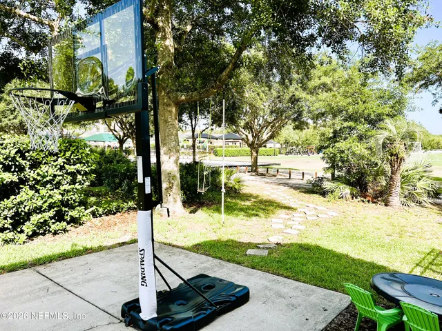 a view of a park with large trees