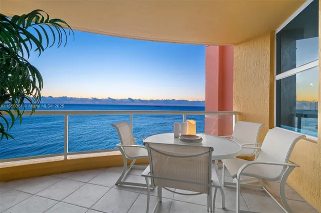 a living room with furniture a large mirror and a table