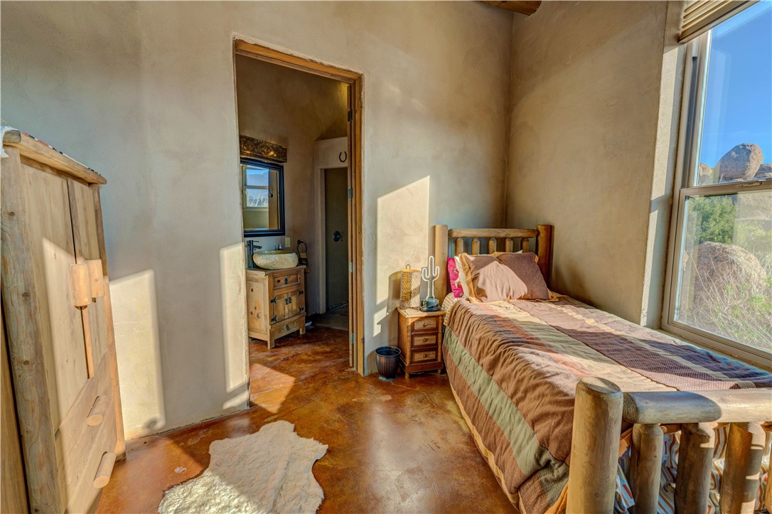 17445 South La Cienega Ranch Road Yucca, AZ 86438 - Photo 16 of 52 a bedroom with a bed and a window
