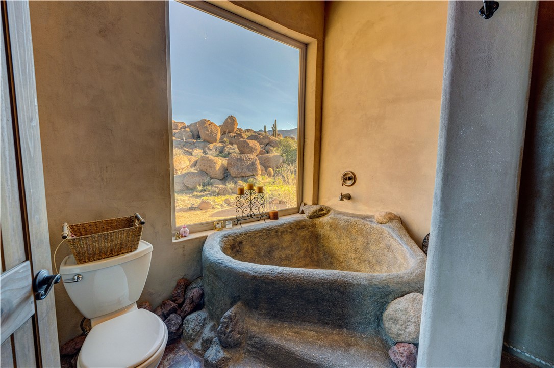 17445 South La Cienega Ranch Road Yucca, AZ 86438 - Photo 21 of 52 a bathroom with a sink and a toilet