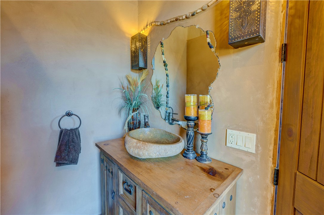 17445 South La Cienega Ranch Road Yucca, AZ 86438 - Photo 23 of 52 a bathroom with a sink and a mirror