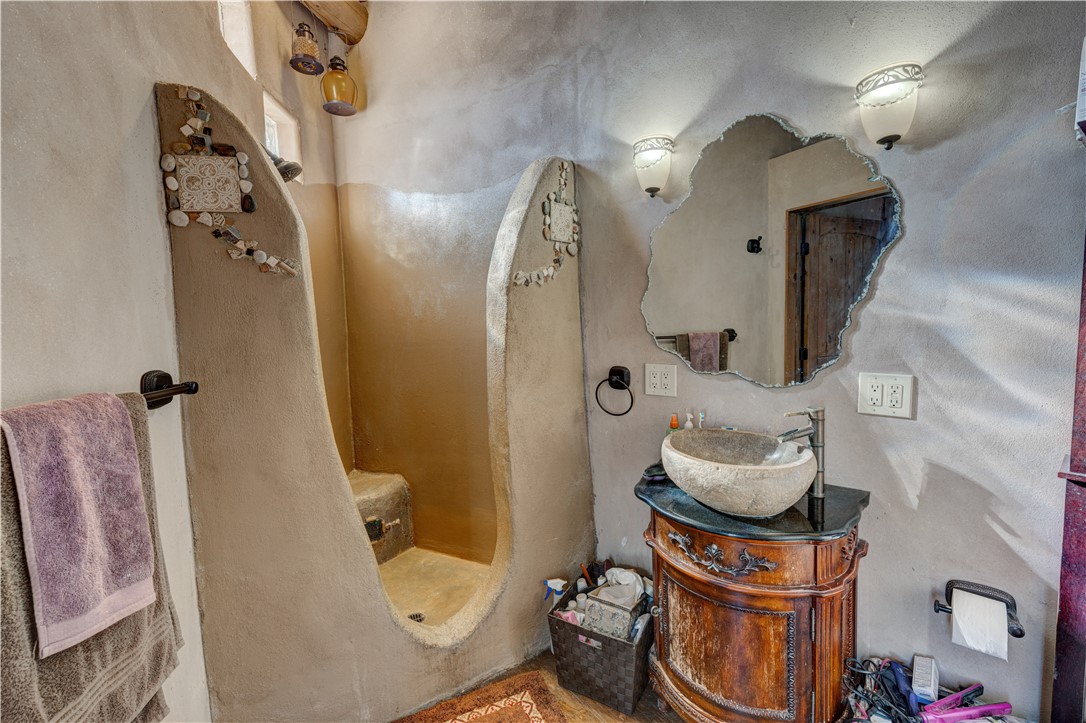 17445 South La Cienega Ranch Road Yucca, AZ 86438 - Photo 27 of 52 a bathroom with a sink and mirror with toilet