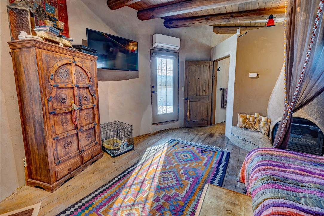 17445 South La Cienega Ranch Road Yucca, AZ 86438 - Photo 28 of 52 a bedroom with a bed and wooden floor
