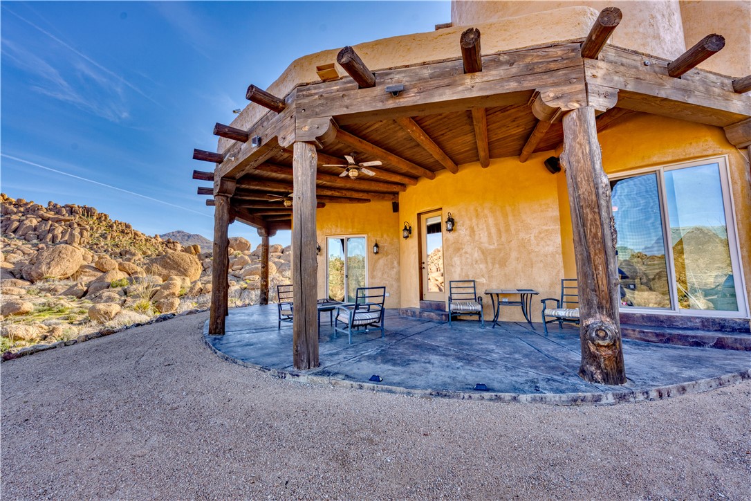 17445 South La Cienega Ranch Road Yucca, AZ 86438 - Photo 31 of 52 a view of a patio with a table and chairs