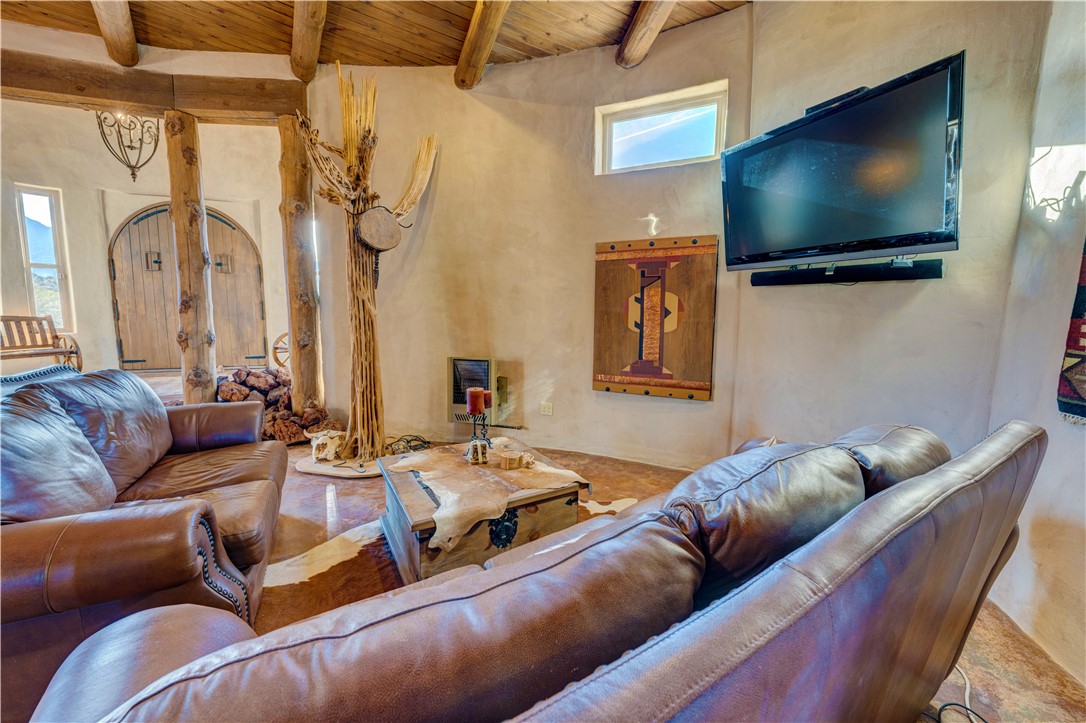 17445 South La Cienega Ranch Road Yucca, AZ 86438 - Photo 6 of 52 a living room with furniture and a flat screen tv