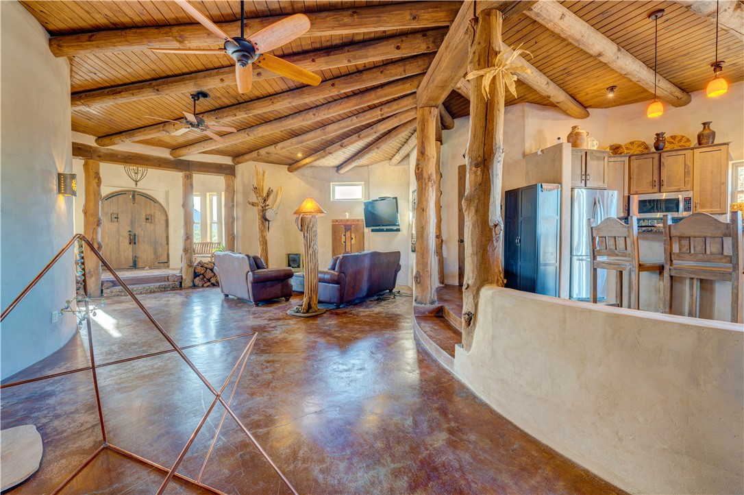 17445 South La Cienega Ranch Road Yucca, AZ 86438 - Photo 9 of 52 a living room with lots of furniture and a chandelier