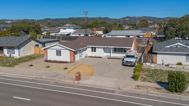 an aerial view of residential houses with outdoor space