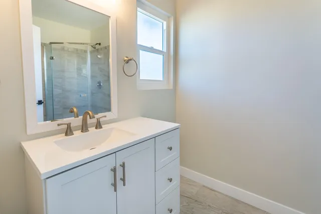 a bathroom with a sink and a mirror