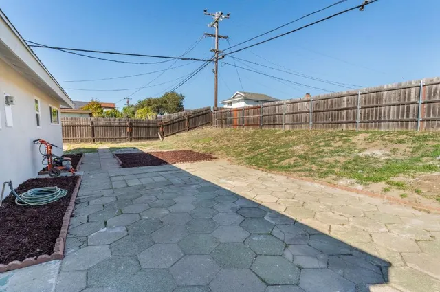 a view of a backyard of the house