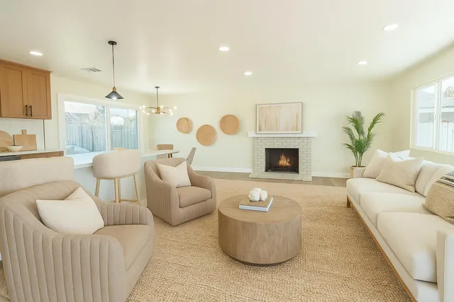 a living room with furniture and a fireplace