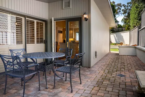 a view of a dining room with furniture and window