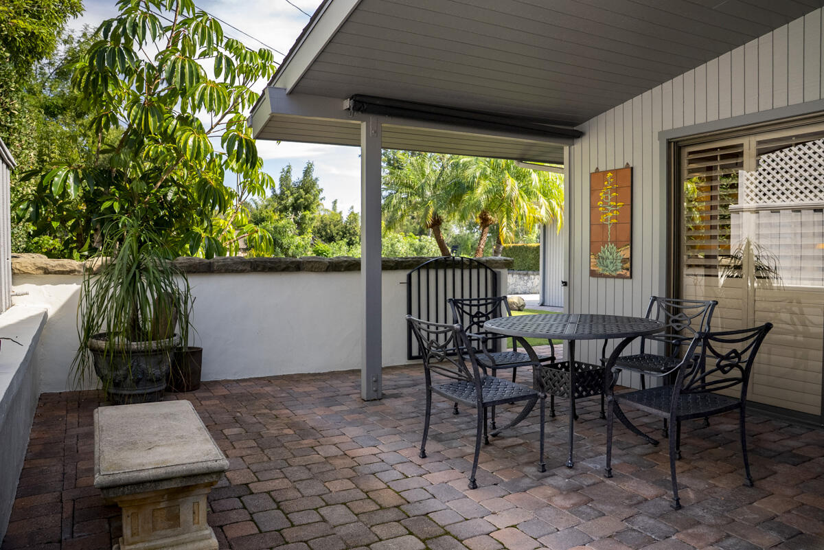 1859 Barker Pass Road Santa Barbara, CA 93108 - Photo 12 of 26 a view of a patio with table and chairs and potted plants
