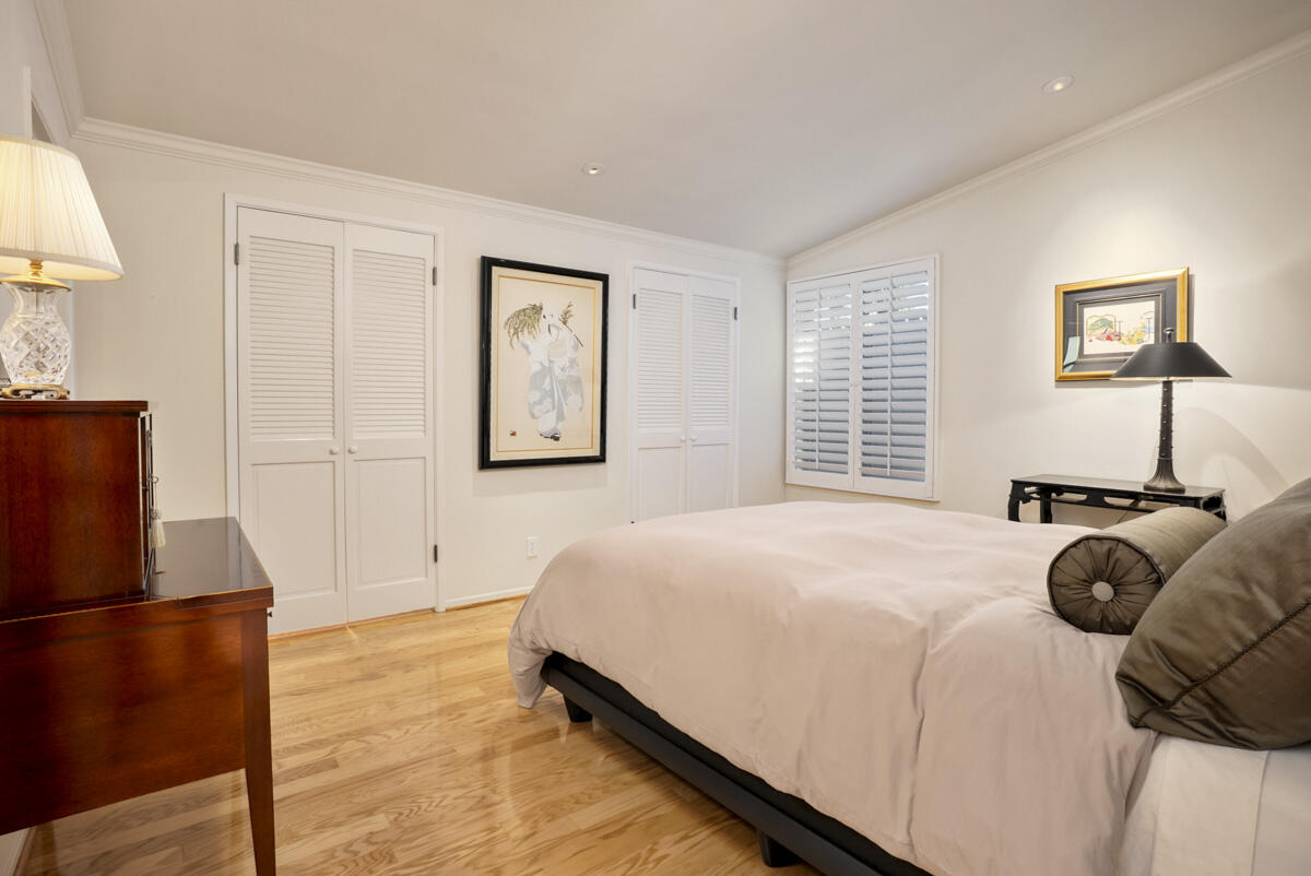 1859 Barker Pass Road Santa Barbara, CA 93108 - Photo 15 of 26 a bedroom with a bed and a refrigerator