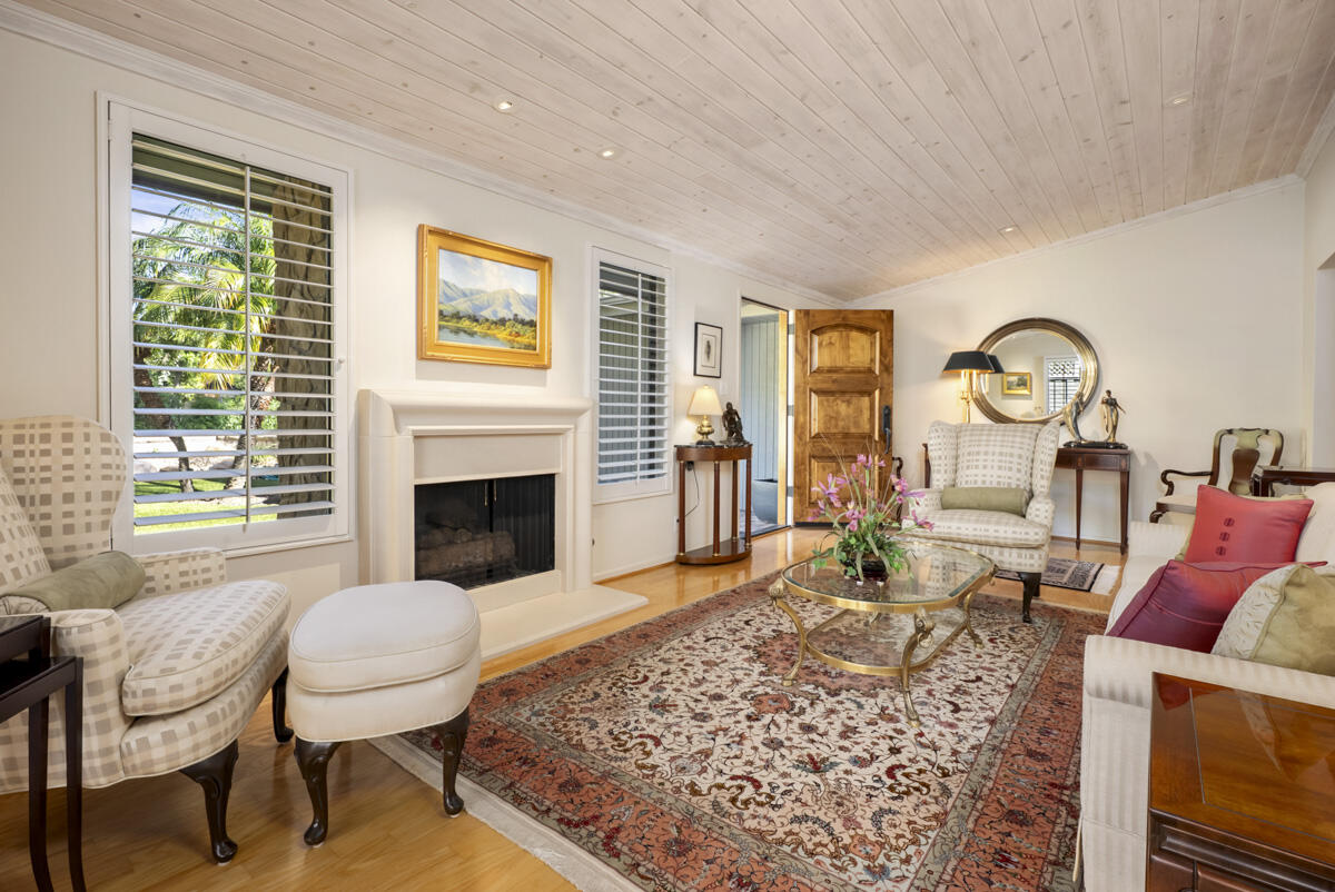 1859 Barker Pass Road Santa Barbara, CA 93108 - Photo 4 of 26 a living room with furniture a rug a fireplace and windows