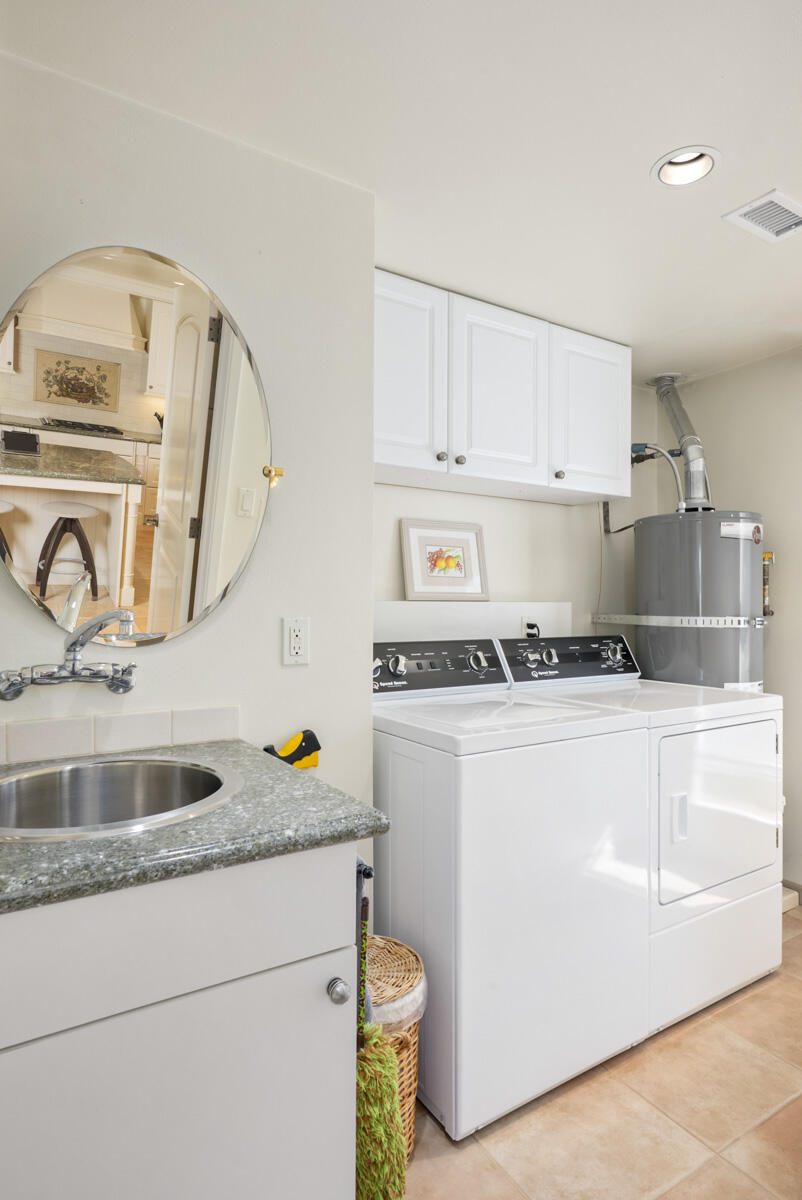 1859 Barker Pass Road Santa Barbara, CA 93108 - Photo 10 of 26 a kitchen with a sink stove and cabinets