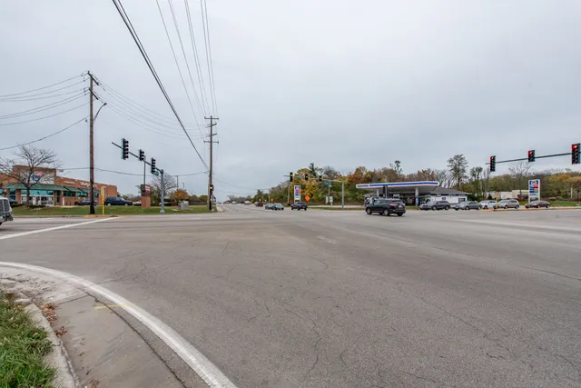 a view of a city street with tall buildings