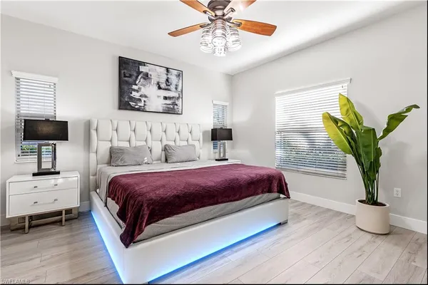 a bathroom with a tub a sink and mirror