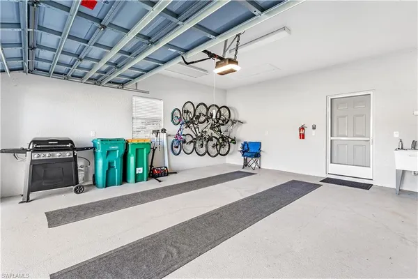an aerial view of residential houses with outdoor space and river