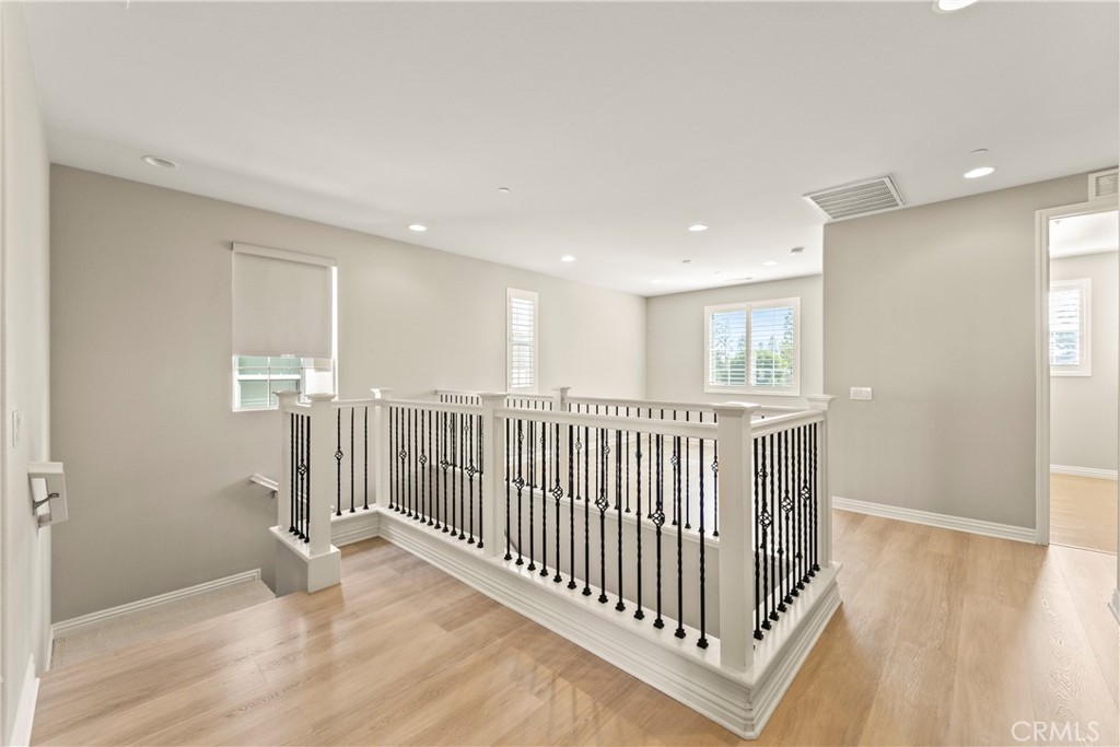 9719 La Vine Court Rancho Cucamonga, CA 91701 - Photo 13 of 39 a view of a hallway with entryway and stairs