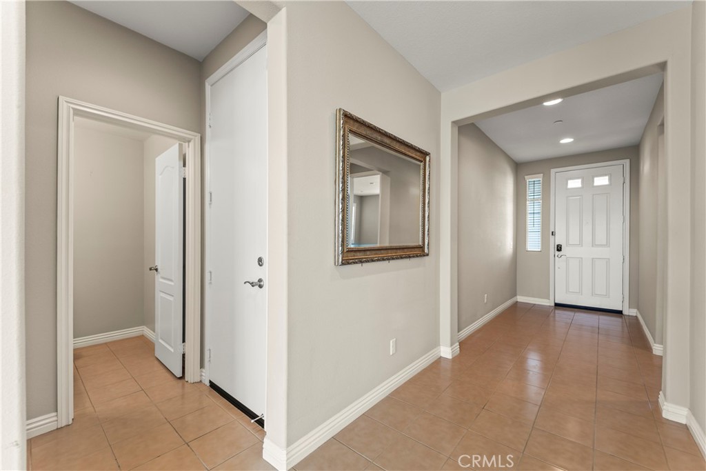9719 La Vine Court Rancho Cucamonga, CA 91701 - Photo 2 of 39 a view of a hallway with wooden shelves