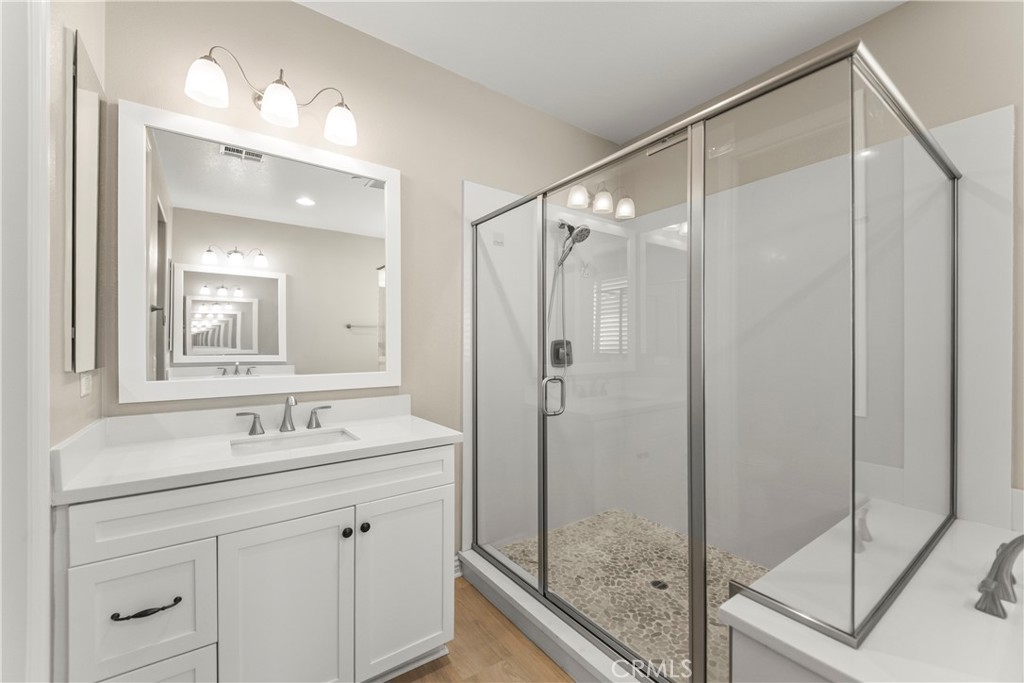9719 La Vine Court Rancho Cucamonga, CA 91701 - Photo 22 of 39 a bathroom with a shower sink vanity and mirror