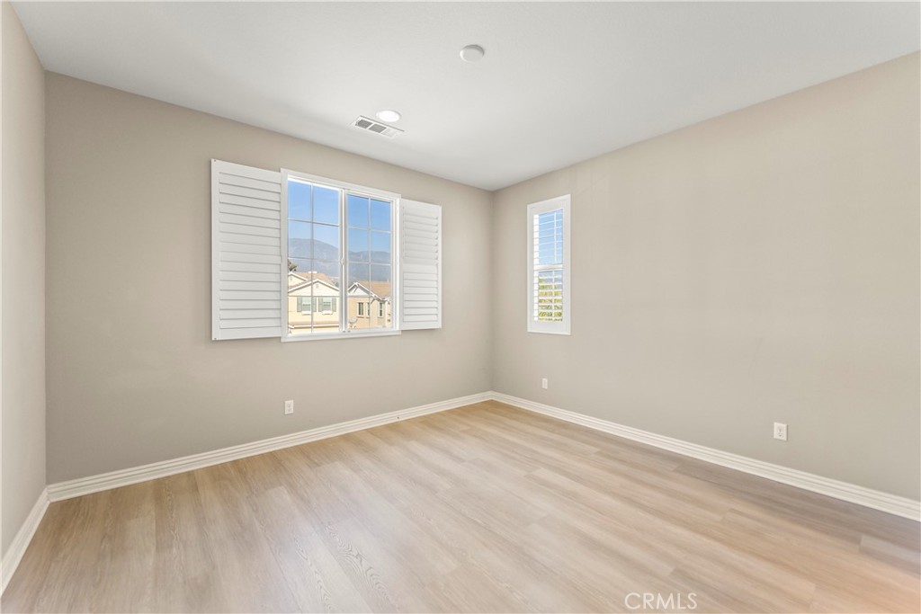 9719 La Vine Court Rancho Cucamonga, CA 91701 - Photo 27 of 39 an empty room with windows