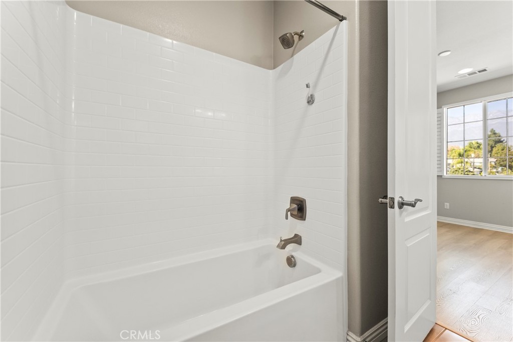 9719 La Vine Court Rancho Cucamonga, CA 91701 - Photo 29 of 39 a bathroom with a bathtub and a shower