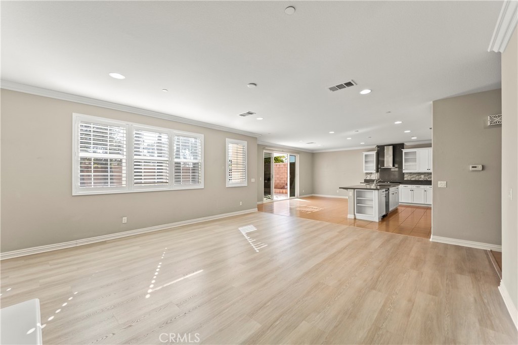 9719 La Vine Court Rancho Cucamonga, CA 91701 - Photo 6 of 39 a view of an empty room with kitchen and window