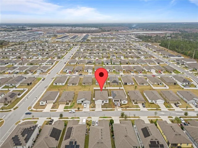 an aerial view of residential building and parking space