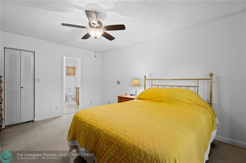 Timberwalk Boca Raton, FL 33428 - Photo 22 of 35 a spacious bedroom with a bed and ceiling fan