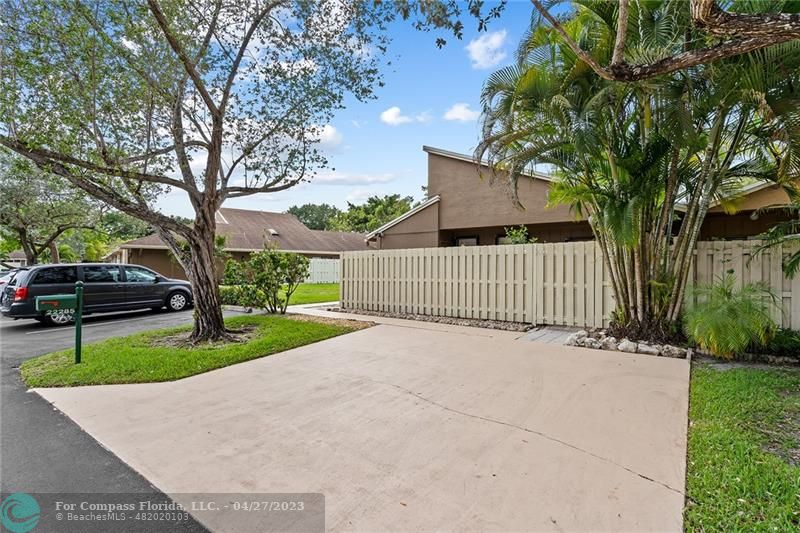 Timberwalk Boca Raton, FL 33428 - Photo 4 of 35 a front view of a house with a yard and a large tree