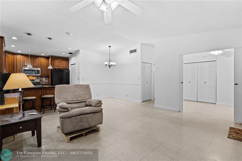 Timberwalk Boca Raton, FL 33428 - Photo 9 of 35 a living room with furniture and a chandelier